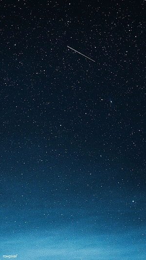 Shooting Star Streaking Across a Deep Blue Night Sky Over Greenland HD phone wallpaper