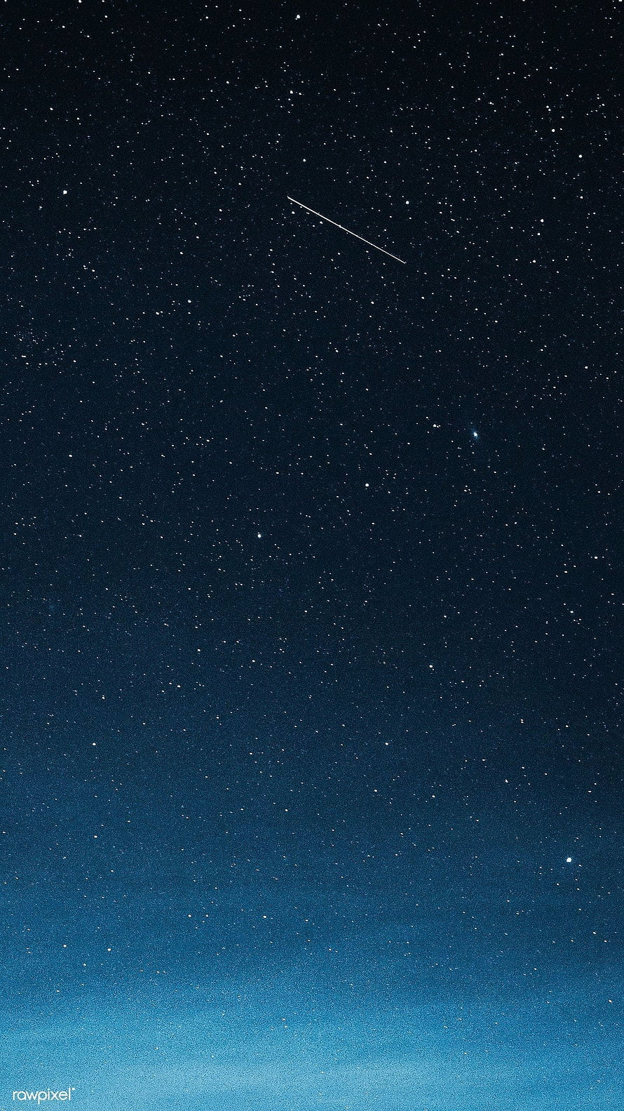 Shooting Star Streaking Across a Deep Blue Night Sky Over Greenland HD phone wallpaper