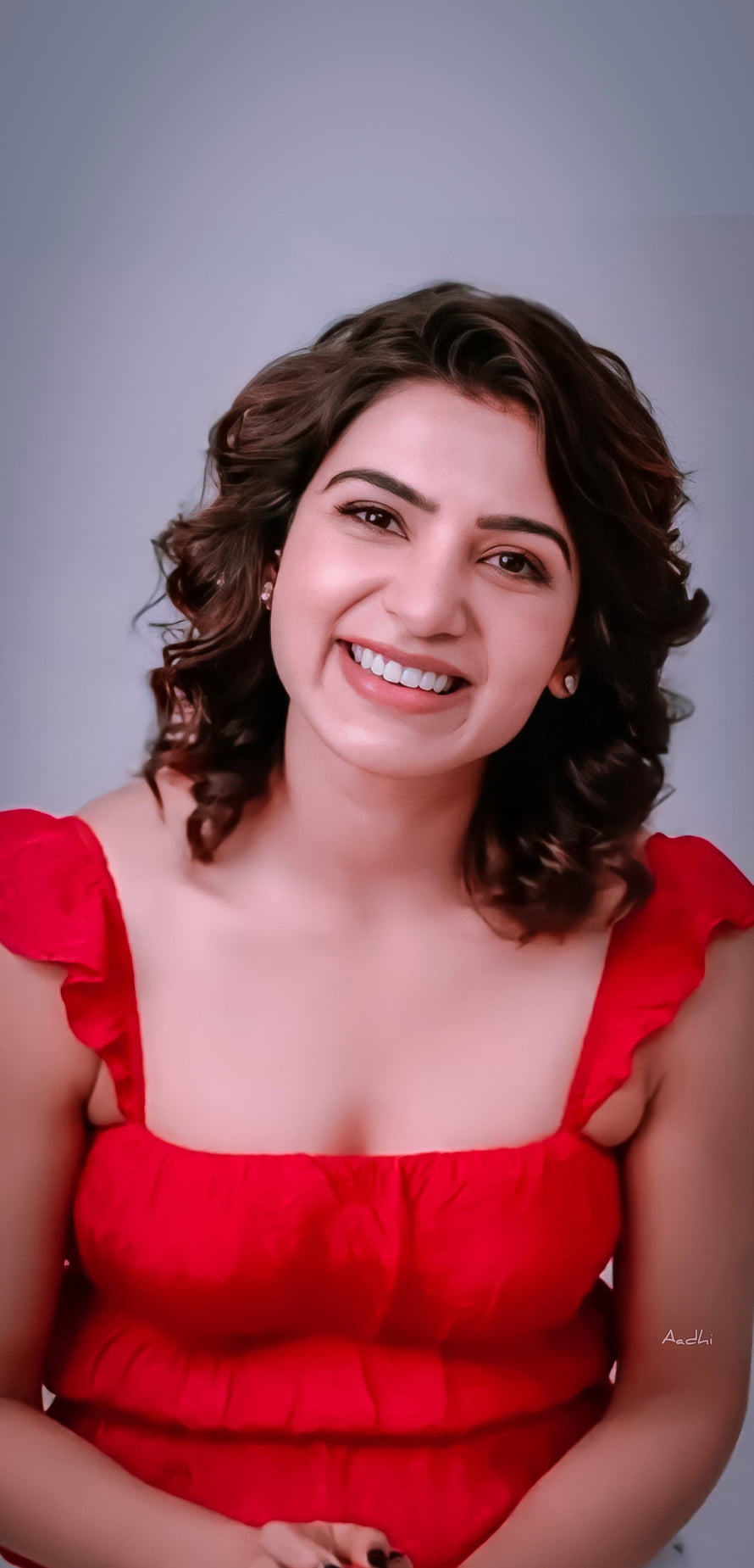 Samantha Akkineni smiling portrait in a vibrant red ruffled dress with wavy hair HD phone wallpaper