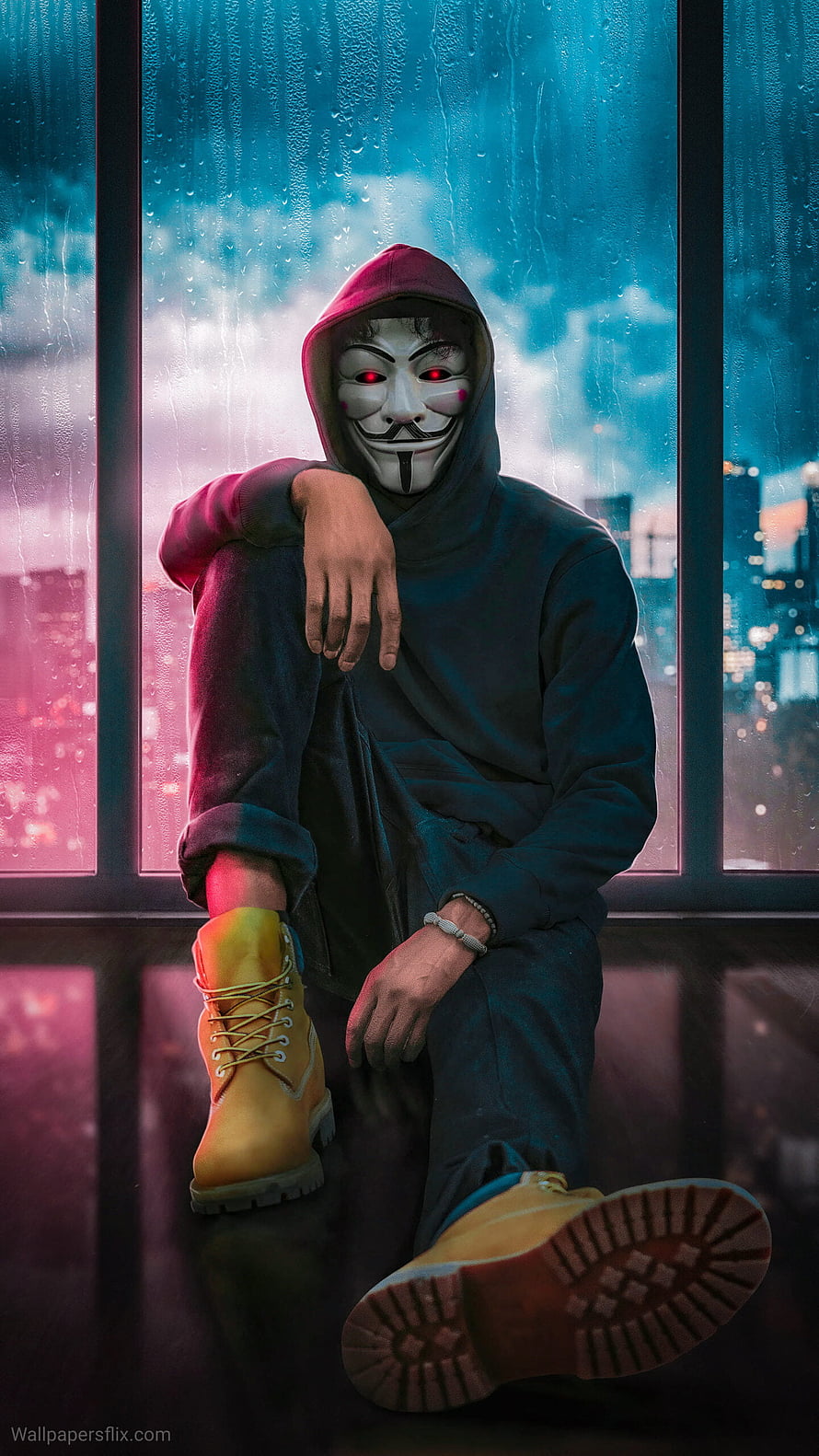 Guy Fawkes Mask Hacker Sitting by Rainy Window with Neon City Lights HD phone wallpaper