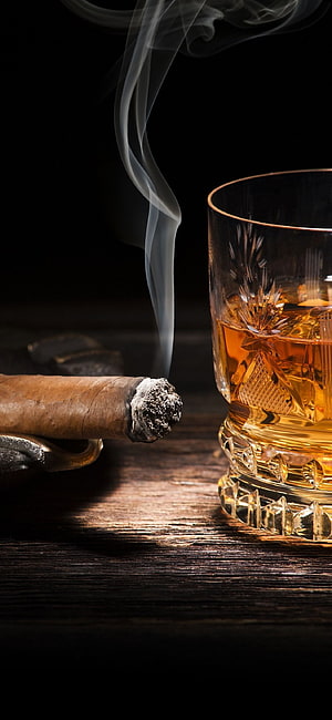 Smoked Cigar and Crystal Whiskey Glass on Dark Wood Table HD phone wallpaper
