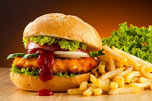 Crispy Chicken Burger With Ketchup, Fresh Lettuce, Tomato, And Golden French Fries HD wallpaper