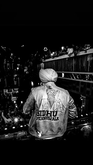 Sidhu Moose Wala Back View on Stage Wearing Leather Jacket with Portrait and Name HD phone wallpaper