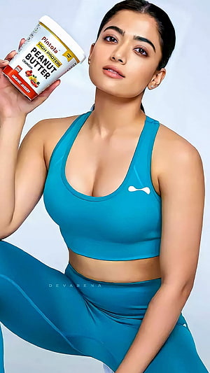 Rashmika Mandanna in Teal Gym Set Holding Pintola Peanut Butter HD phone wallpaper