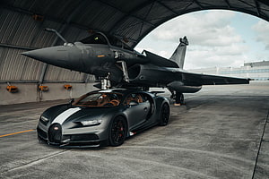 Bugatti Chiron Sport and Dassault Rafale Jet in Hangar Setting HD wallpaper