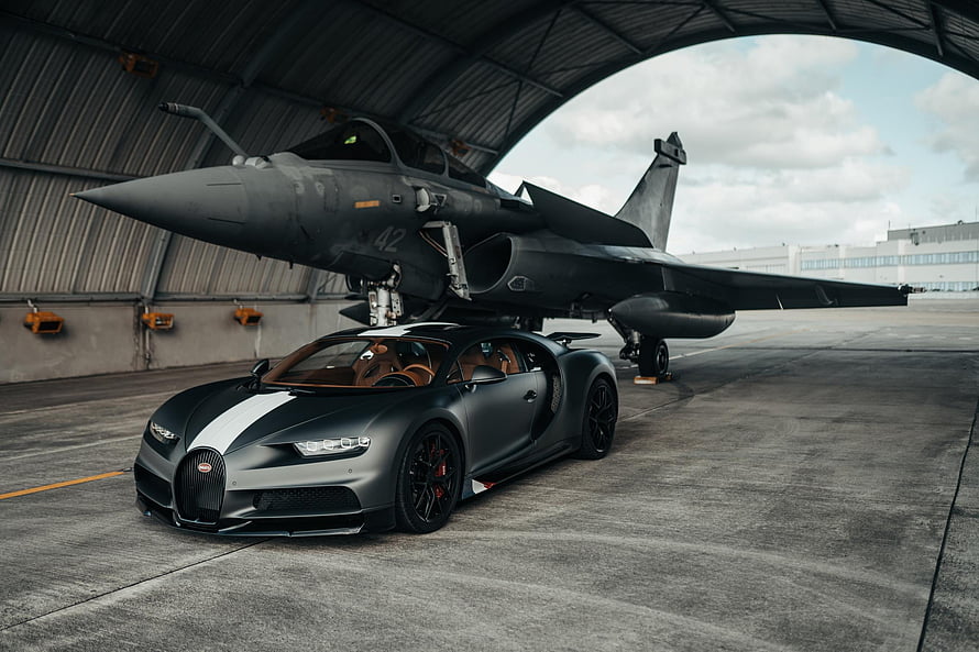 Bugatti Chiron Sport and Dassault Rafale Jet in Hangar Setting HD wallpaper