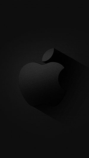 Minimalist Black Apple Logo with Subtle Texture and Long Shadow on Dark Background HD phone wallpaper