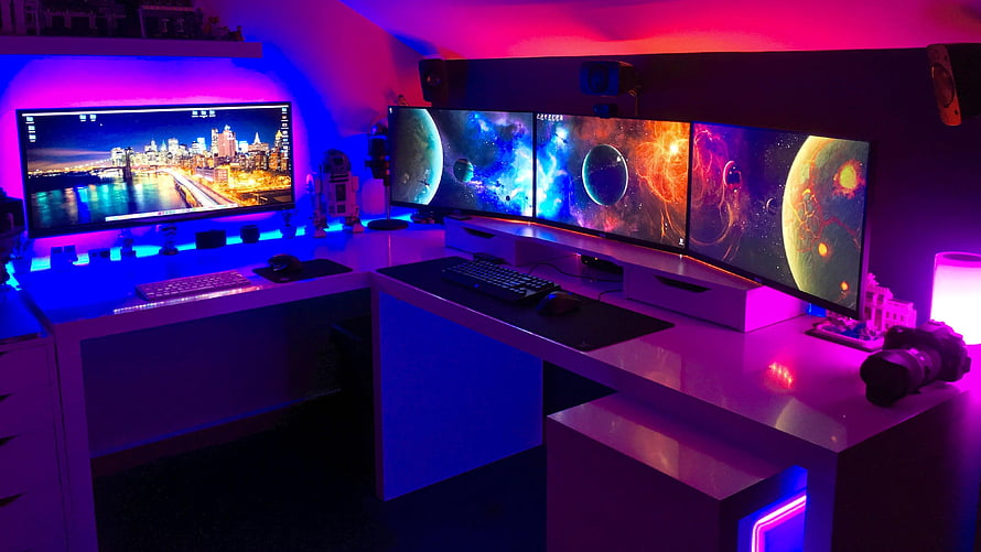 Multi-Monitor Gaming Desk with Neon RGB Lighting and Space Wallpapers HD wallpaper