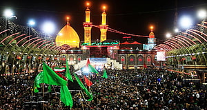 Karbala Night Gathering with Green Flags and Illuminated Mosque HD wallpaper