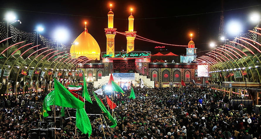 Karbala Night Gathering with Green Flags and Illuminated Mosque HD wallpaper