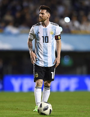 Lionel Messi in Argentina National Team Kit on the Soccer Pitch HD phone wallpaper