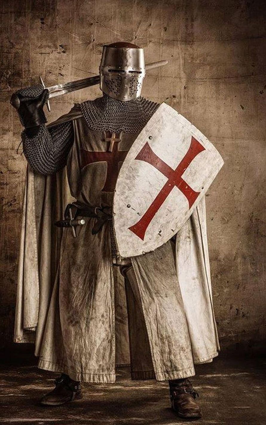Medieval Crusader Knight in Full Plate Armor Holding Sword and Cross Shield HD phone wallpaper