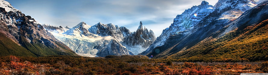 Snow-Capped Mountain Range with Autumn Foliage and Glaciers in a Panoramic Valley Landscape HD wallpaper