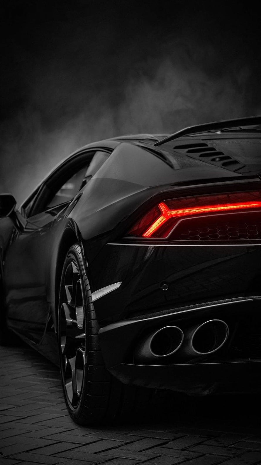 Black Lamborghini Aventador Rear View with Glowing Red Taillights and Dual Exhausts in Dark Moody Setting HD phone wallpaper