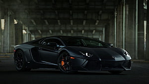Matte Black Lamborghini Aventador LP700-4 in a Dark Industrial Concrete Tunnel HD wallpaper