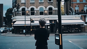 Jaehyun NCT Standing at a London Street Corner in Front of a Classic Pub HD wallpaper