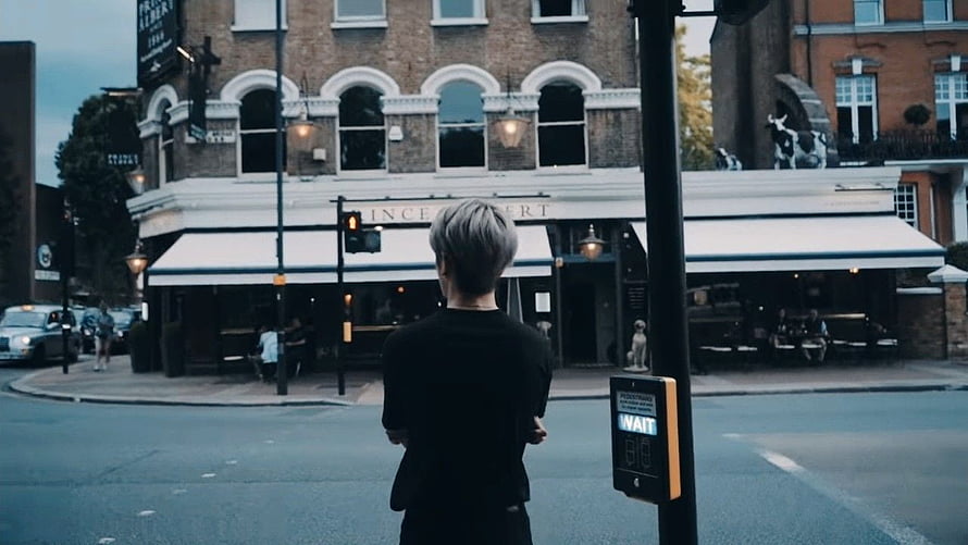 Jaehyun NCT Standing at a London Street Corner in Front of a Classic Pub HD wallpaper