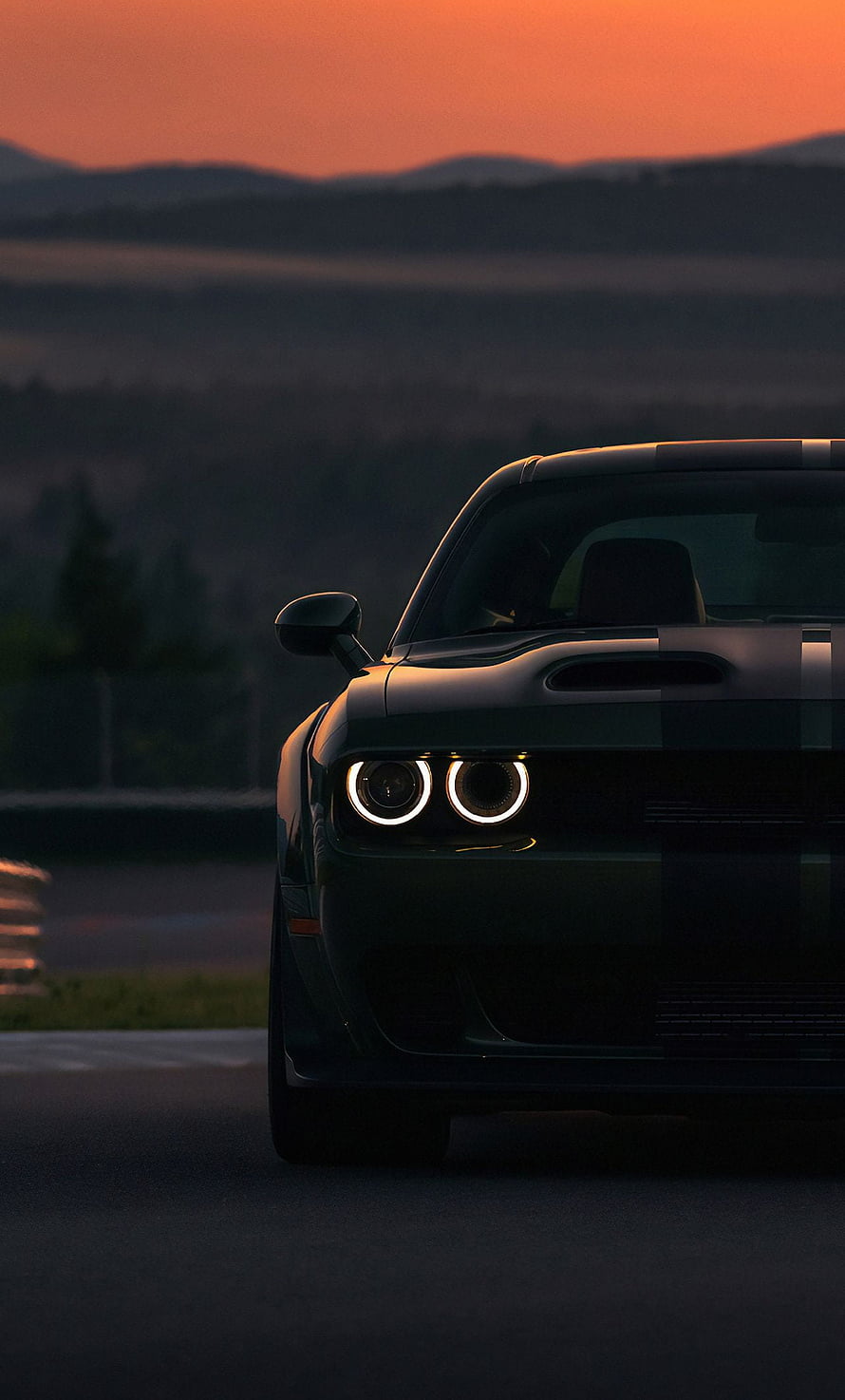 Dodge Charger SRT Hellcat Front View at Sunset with Glowing Headlights on a Dark Road HD phone wallpaper
