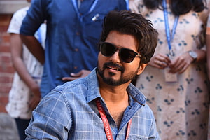 Vijay in casual denim shirt and sunglasses at a public event HD wallpaper