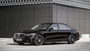 Black Mercedes-Benz S-Class Sedan Parked Against Modern Architectural Facade HD wallpaper