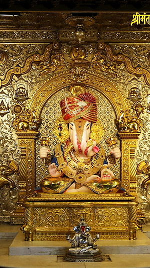 Dagdusheth Ganpati Murti in Ornate Golden Temple Setting HD phone wallpaper