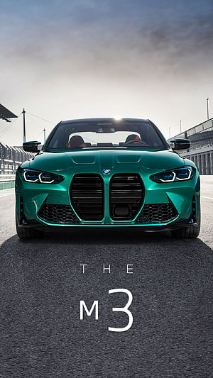 Front View of a Green BMW M3 on a Race Track Under a Dramatic Sky HD phone wallpaper