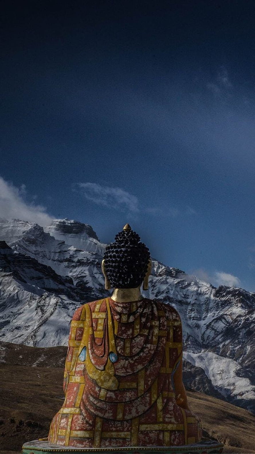 Buddha Statue Viewed From Behind Against Snow-Capped Himalayan Peaks HD phone wallpaper