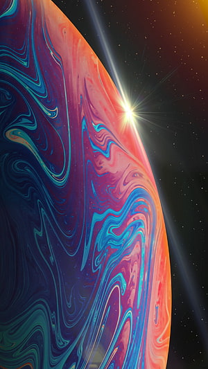 Vibrant Swirling Planet with Starburst in Deep Space HD phone wallpaper
