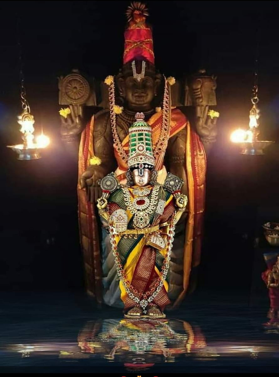 Sri Venkateswara Temple Deity with Ornate Jewelry and Sacred Oil Lamps HD phone wallpaper