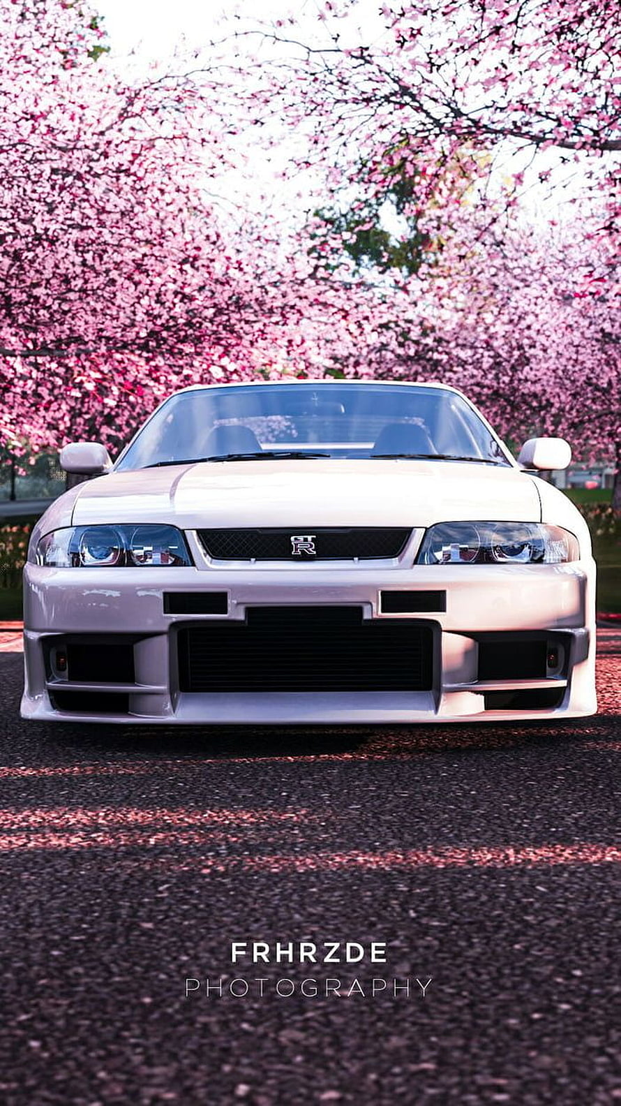 White Nissan Skyline R33 GT-R Front View Under Cherry Blossom Trees HD phone wallpaper