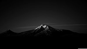 Dramatic Black and White Snow-Capped Mountain Peak at Dusk HD wallpaper