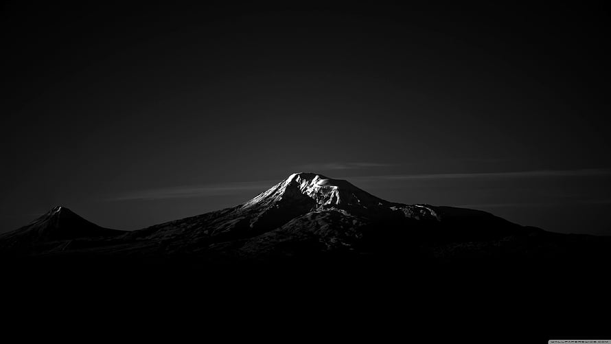 Dramatic Black and White Snow-Capped Mountain Peak at Dusk HD wallpaper