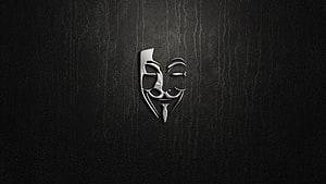 Stylized Guy Fawkes Mask Emblem on Dark Textured Background HD wallpaper