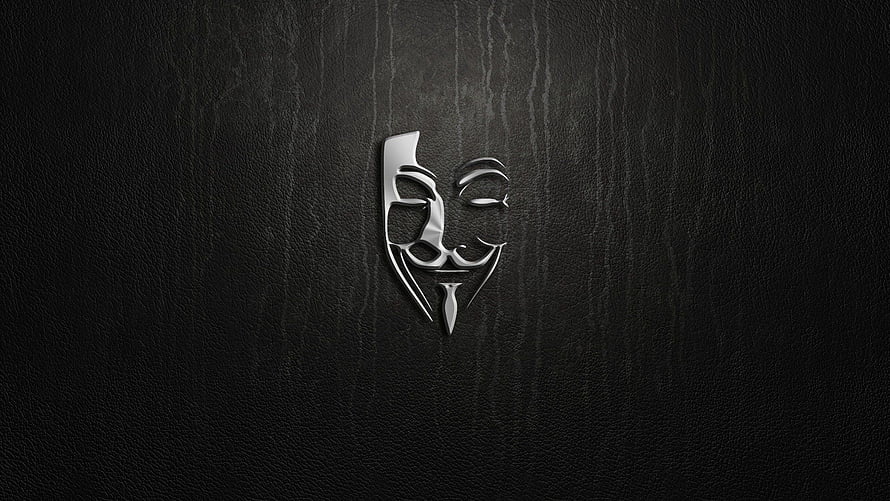 Stylized Guy Fawkes Mask Emblem on Dark Textured Background HD wallpaper