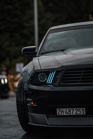 Black Ford Mustang Front End Close-Up With Blue LED Headlight Accents HD phone wallpaper