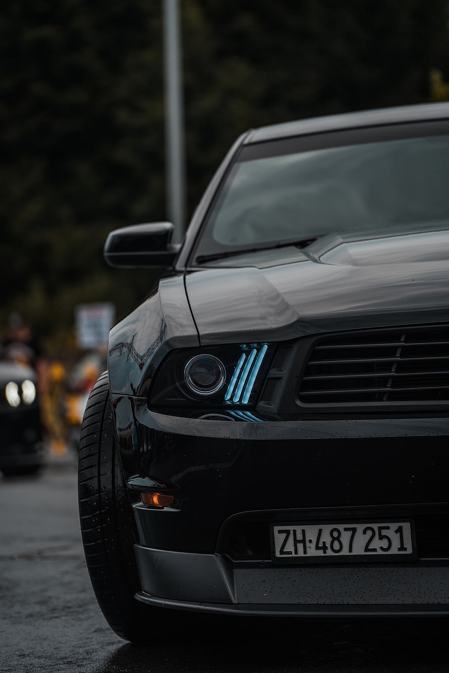Black Ford Mustang Front End Close-Up With Blue LED Headlight Accents HD phone wallpaper