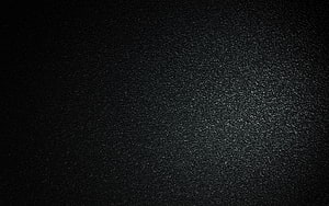 Dark Asphalt Surface Texture with Subtle Stone Grain and Vignette Lighting HD wallpaper