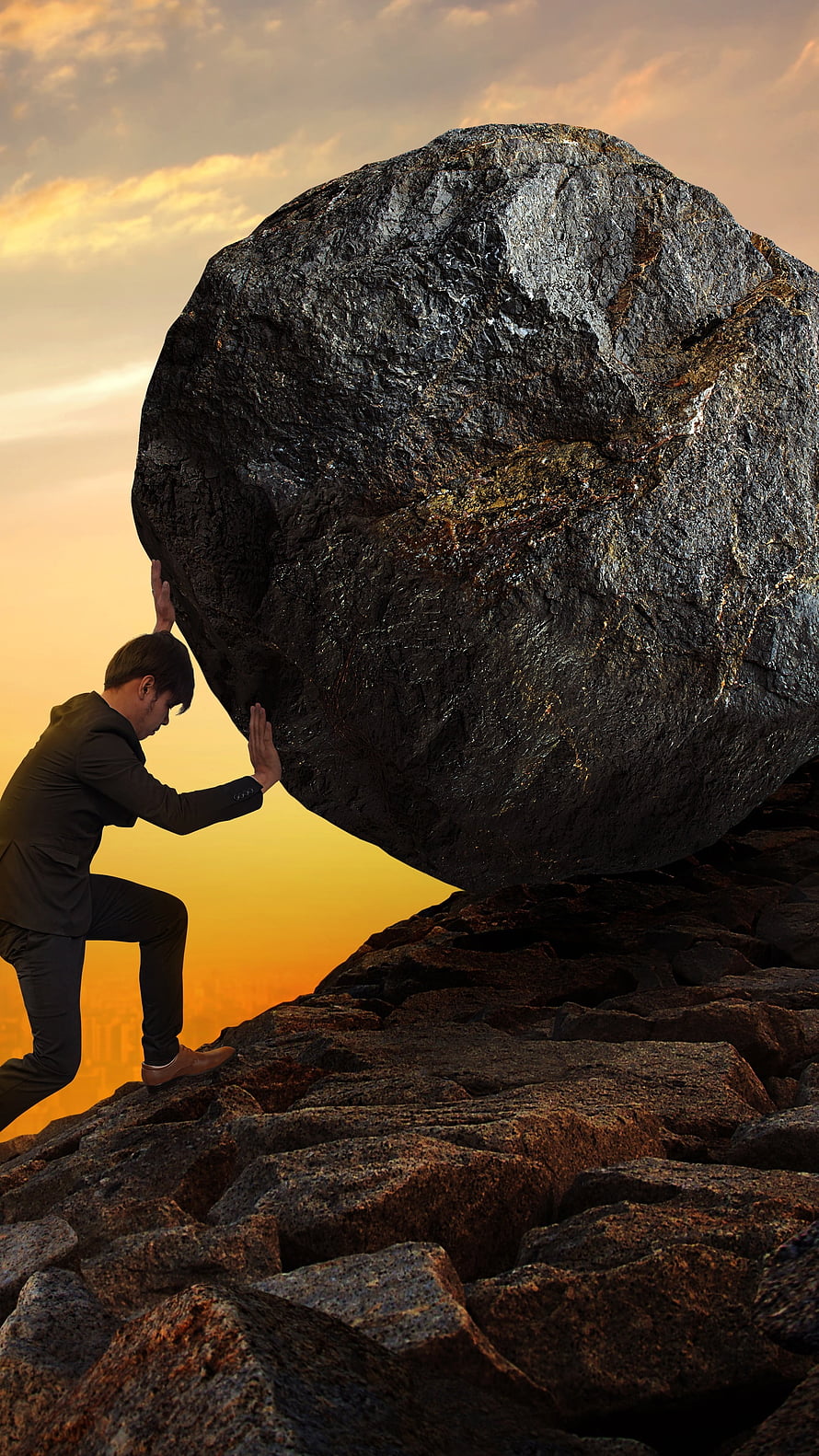 Businessman Pushing Massive Boulder Uphill at Sunset HD phone wallpaper