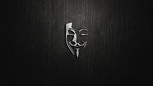 Sleek Silver Anonymous Guy Fawkes Mask Emblem on Dark Textured Background HD wallpaper