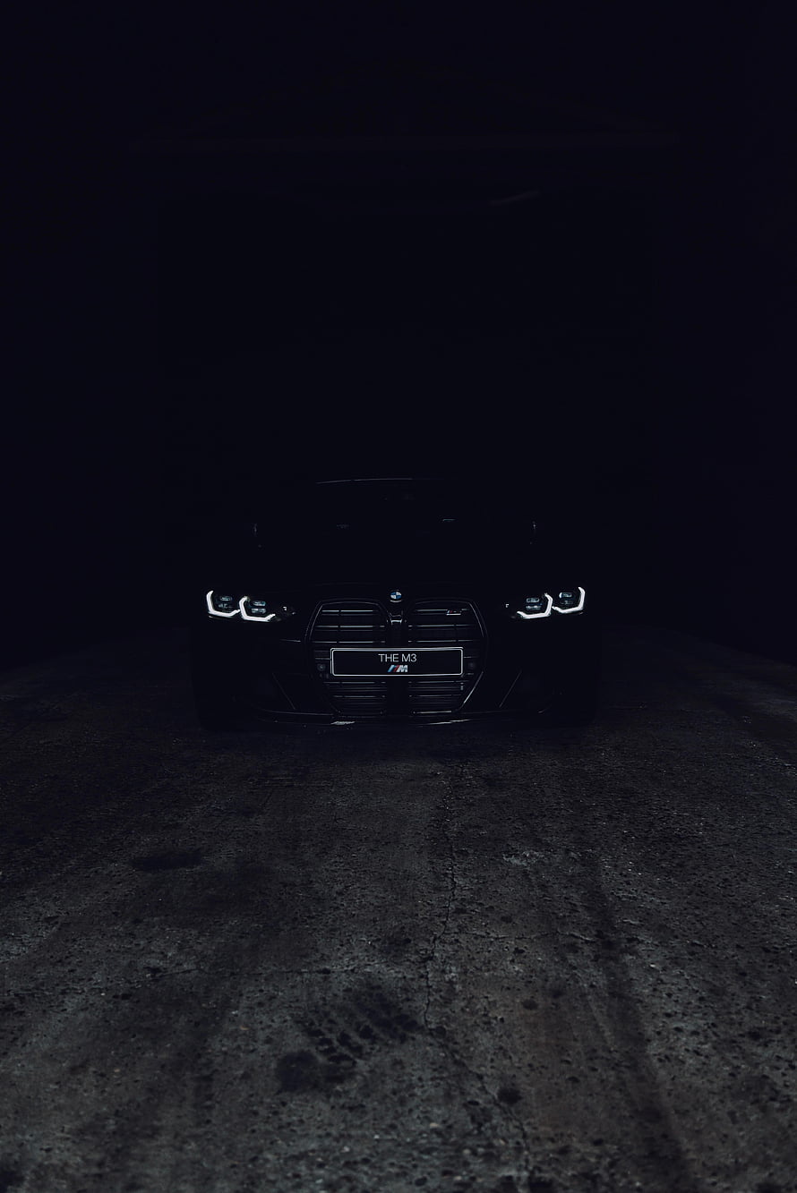 BMW M3 Front View in Darkness with Glowing Headlights and Grille HD phone wallpaper
