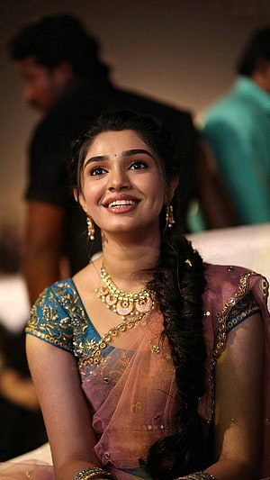 Krithi Shetty in Traditional Indian Attire with Gold Jewelry and Long Braid HD phone wallpaper