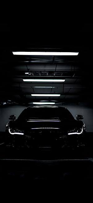 Black Audi R8 Front View in Dark Parking Garage with LED Headlights and Fluorescent Ceiling Lights HD phone wallpaper
