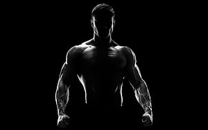 Dramatic Black and White Silhouette of a Muscular Male Athlete with Defined Physique HD wallpaper