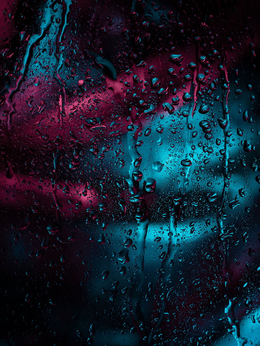Moody Macro Shot of Rain Droplets on Glass with Neon Cyan and Magenta Lighting HD phone wallpaper