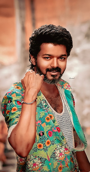 Thalapathy Vijay in a vibrant floral shirt with a confident pose and styled beard HD phone wallpaper