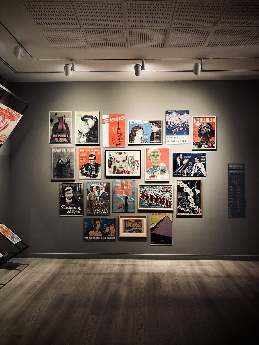 Vintage Propaganda Poster Collection Displayed in a Modern Art Gallery HD phone wallpaper