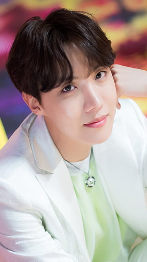 J-Hope from BTS in a white blazer and mint green shirt with a pearl pendant necklace HD phone wallpaper
