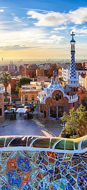 Park Guell Mosaic Balustrade and Gaudi Architecture Overlooking Barcelona Cityscape at Sunset HD phone wallpaper