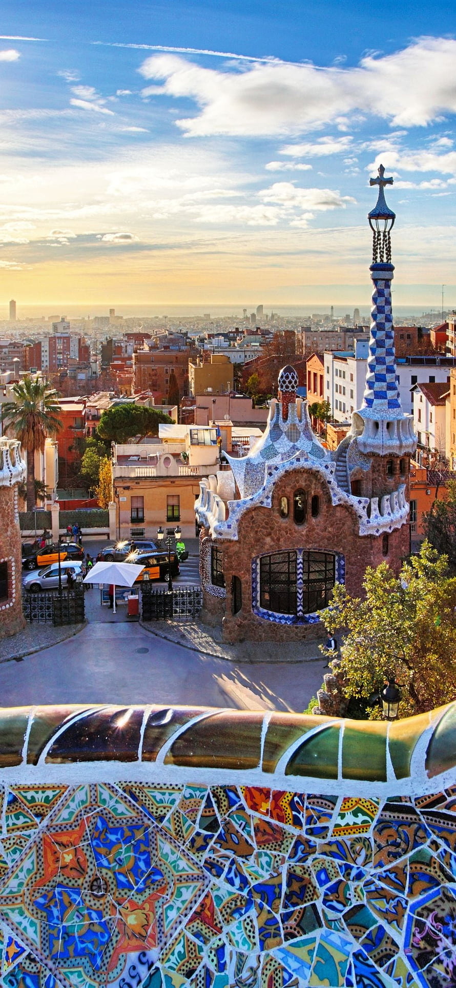 Park Guell Mosaic Balustrade and Gaudi Architecture Overlooking Barcelona Cityscape at Sunset HD phone wallpaper
