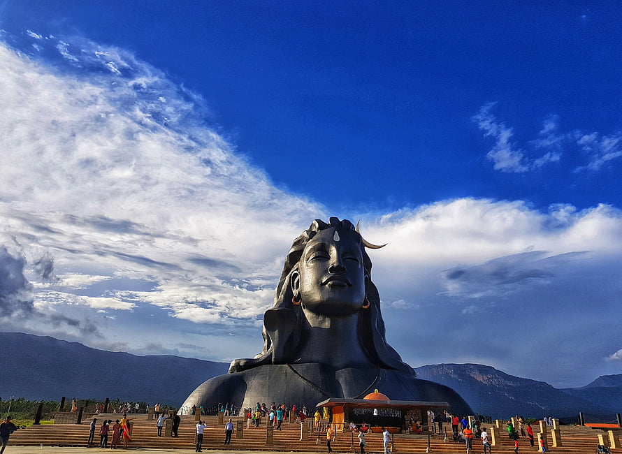Adiyogi Statue at Isha Foundation with Mountain Backdrop and Blue Sky HD wallpaper